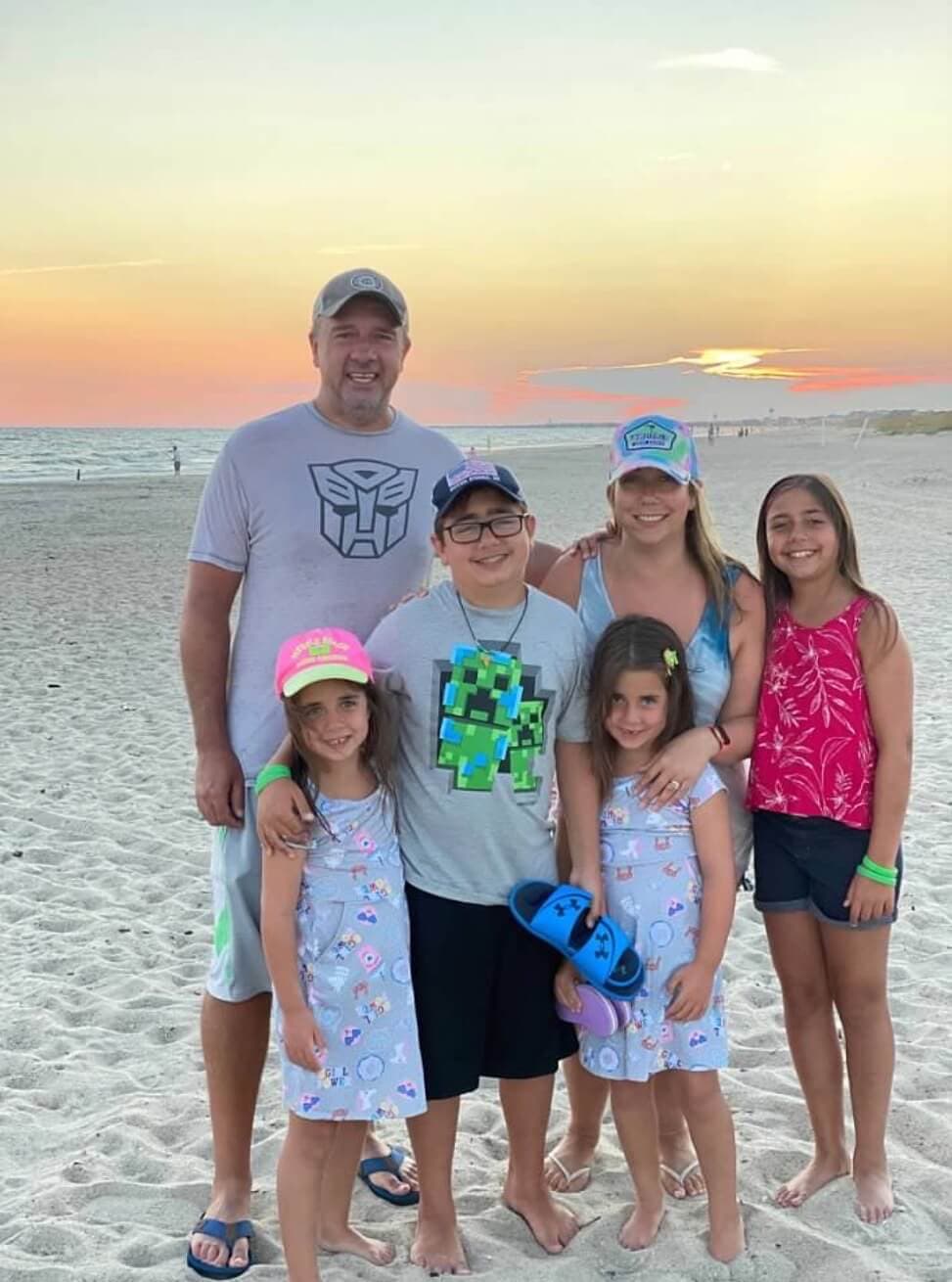 A family beach photo marking the life chapter that followed the early offshore years