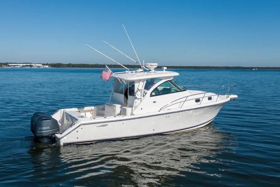 Blue Syndicate II — Pursuit Offshore express on calm water, outriggers up and twin Yamaha outboards astern